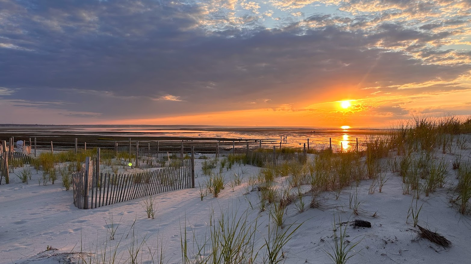 Sunset at Chapin beach over the dunes and water