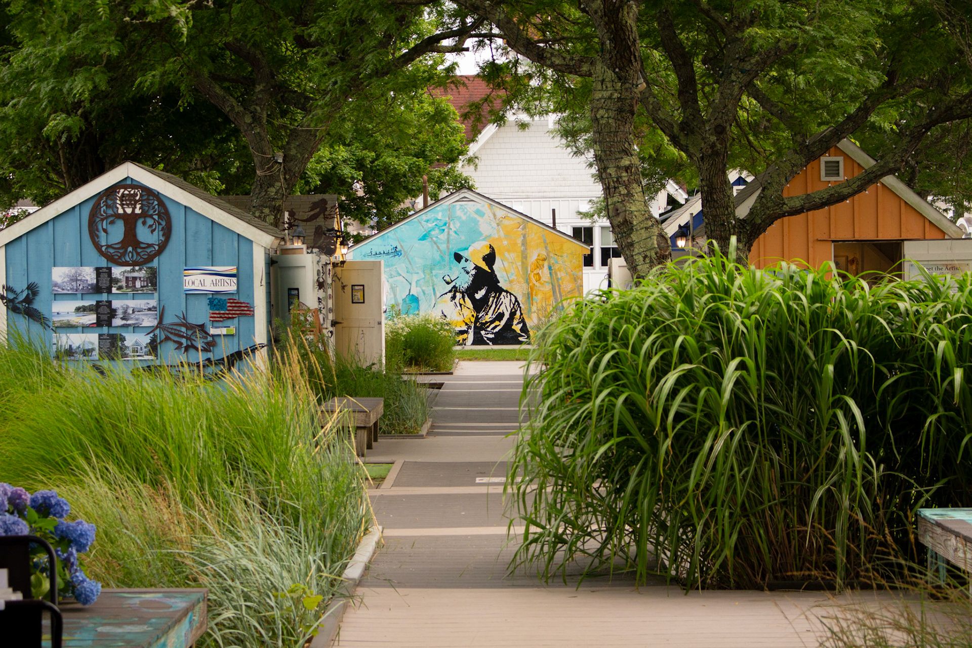 Flower-lined path with various vendor sheds