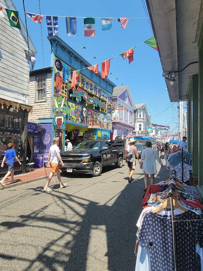 Busy shoppinh street with flags and shoppers
